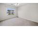 Bedroom with neutral walls, carpet, ceiling fan, and window at 3609 Indigo Creek Nw Trl, Kennesaw, GA 30144
