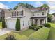 Charming two-story home featuring manicured landscaping, a two-car garage, and inviting front porch at 3609 Indigo Creek Nw Trl, Kennesaw, GA 30144