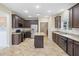Modern kitchen with stainless steel appliances, granite countertops, an island, and ample cabinet storage at 3609 Indigo Creek Nw Trl, Kennesaw, GA 30144