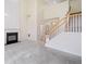 Open-concept living room featuring a fireplace, staircase, and ample natural light for a bright, airy feel at 3609 Indigo Creek Nw Trl, Kennesaw, GA 30144
