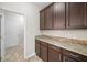 Walk-in pantry with abundant shelving space and granite countertops at 3609 Indigo Creek Nw Trl, Kennesaw, GA 30144