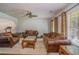Cozy living room with a ceiling fan, hardwood floors, neutral paint and comfortable leather furniture at 493 Whaleys Lake Dr, Jonesboro, GA 30238