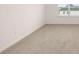 Carpeted bedroom with a large window with a view to the outside at 1179 Blue Juniper Cir, Loganville, GA 30052