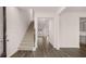Bright foyer featuring hardwood floors and staircase leading upstairs at 1179 Blue Juniper Cir, Loganville, GA 30052