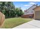 A spacious, grassy backyard enclosed by wooden fences, perfect for outdoor activities at 1239 Grampian Pass # 11, Marietta, GA 30008