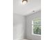 Bright, cozy bedroom with a window overlooking lush greenery, creating a serene atmosphere at 1239 Grampian Pass # 11, Marietta, GA 30008