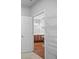 Walk-in closet leading to bathroom with a double vanity, offering ample storage space at 1239 Grampian Pass # 11, Marietta, GA 30008