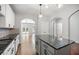 Spacious kitchen with hardwood flooring, island and granite countertops at 1239 Grampian Pass # 11, Marietta, GA 30008