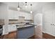 Bright kitchen featuring granite countertops and a central island at 1239 Grampian Pass # 11, Marietta, GA 30008
