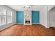 Bright living room featuring hardwood floors, fireplace and large windows at 1239 Grampian Pass # 11, Marietta, GA 30008