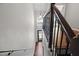 Elegant staircase with wood treads, iron spindles, and a view of the front door at 1239 Grampian Pass # 11, Marietta, GA 30008