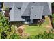 Aerial view of a home featuring a deck, patio, landscaped yard, and a well-maintained roof, highlighting its outdoor living spaces at 220 Webley Ln, Alpharetta, GA 30022