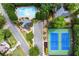 Community aerial view featuring a pool, tennis courts, and playground; all surrounded by mature trees at 220 Webley Ln, Alpharetta, GA 30022
