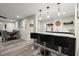 Basement featuring a wet bar, barstools, countertop, and an open dining area at 220 Webley Ln, Alpharetta, GA 30022