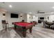 Finished basement featuring a pool table, chairs, and a seating area for relaxation or entertaining at 220 Webley Ln, Alpharetta, GA 30022