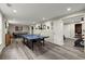 Spacious finished basement with ping pong table, air hockey and workout room at 220 Webley Ln, Alpharetta, GA 30022
