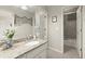 Stylish bathroom featuring granite counters, tiled floors, and a shower over tub at 220 Webley Ln, Alpharetta, GA 30022