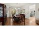 Elegant dining room with hardwood floors and large window, perfect for Gathering gatherings at 220 Webley Ln, Alpharetta, GA 30022