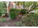Beautiful exterior view of a home with mature landscaping, showcasing the well-maintained yard and architectural details at 220 Webley Ln, Alpharetta, GA 30022