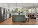 Stylish kitchen with a spacious island, stainless appliances, and a bright, open layout to the breakfast area at 220 Webley Ln, Alpharetta, GA 30022