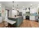 Modern kitchen with an island, pendant lights, and stainless appliances, perfect for cooking at 220 Webley Ln, Alpharetta, GA 30022