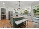 Bright kitchen with island seating, stone countertops, stainless appliances, and lots of natural light at 220 Webley Ln, Alpharetta, GA 30022