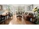 Cozy living room filled with natural light, showcasing hardwood floors and comfortable furniture at 220 Webley Ln, Alpharetta, GA 30022