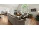 Elegant living room with soaring windows, hardwood flooring, and open concept design at 220 Webley Ln, Alpharetta, GA 30022