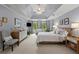 Bright main bedroom with tray ceilings, plush carpet, and serene color palette at 220 Webley Ln, Alpharetta, GA 30022