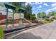 Community playground with slide, climbing structures, and bench, perfect for outdoor fun at 220 Webley Ln, Alpharetta, GA 30022