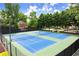 Well-maintained tennis courts with lighting in a well-kept community at 220 Webley Ln, Alpharetta, GA 30022