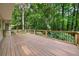 Expansive back deck with railings, providing ample space for outdoor seating and entertaining at 127 Roe Hampton Ln Ln, Stone Mountain, GA 30087