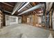 Large unfinished basement with concrete floor, exposed ductwork, access doors, and plenty of potential at 127 Roe Hampton Ln Ln, Stone Mountain, GA 30087