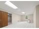 Finished basement featuring tile flooring, natural light, and ample room for activities at 127 Roe Hampton Ln Ln, Stone Mountain, GA 30087