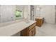 Bright bathroom with dual vanities and wooden cabinets, providing ample space and convenience for daily routines at 127 Roe Hampton Ln Ln, Stone Mountain, GA 30087
