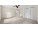 A large primary bedroom with neutral walls, ceiling fan, and ample closet space at 127 Roe Hampton Ln Ln, Stone Mountain, GA 30087