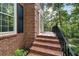 Elegant brick front porch, showcasing classic design and inviting entrance at 127 Roe Hampton Ln Ln, Stone Mountain, GA 30087