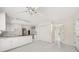 Spacious kitchen with modern white cabinets and an island, offering ample counter space and storage solutions at 127 Roe Hampton Ln Ln, Stone Mountain, GA 30087