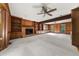 Spacious living room features a brick fireplace and built in wood cabinets at 127 Roe Hampton Ln Ln, Stone Mountain, GA 30087