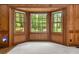 Bright living room features a bay window overlooking a lush, green landscape at 127 Roe Hampton Ln Ln, Stone Mountain, GA 30087