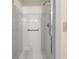 Bright bathroom shower featuring updated tile and hand rails for added safety and convenience at 127 Roe Hampton Ln Ln, Stone Mountain, GA 30087