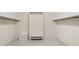 Spacious walk-in closet with custom shelving and storage, providing ample room for organization and wardrobe management at 127 Roe Hampton Ln Ln, Stone Mountain, GA 30087