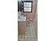 Bathroom features a window view, a toilet, sink and vanity, and checkered floors at 2289 Addison Rd, Marietta, GA 30066