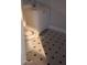 Bathroom features a toilet, sink and vanity, and checkered floors at 2289 Addison Rd, Marietta, GA 30066