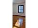 Bedroom features hardwood floors and natural light from the window at 2289 Addison Rd, Marietta, GA 30066