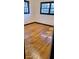 Bedroom features hardwood floors and natural light from the windows at 2289 Addison Rd, Marietta, GA 30066