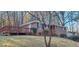 Brick home featuring a side deck and mature trees at 2289 Addison Rd, Marietta, GA 30066