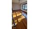 Bright living room featuring hardwood floors, a modern chandelier, and large windows at 2289 Addison Rd, Marietta, GA 30066