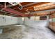 Unfinished basement garage with concrete floor and exposed ceiling at 3131 Garden Lane Dr, Marietta, GA 30062