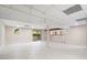Finished basement with white tile floors, bar area, and access to the outdoors at 3131 Garden Lane Dr, Marietta, GA 30062